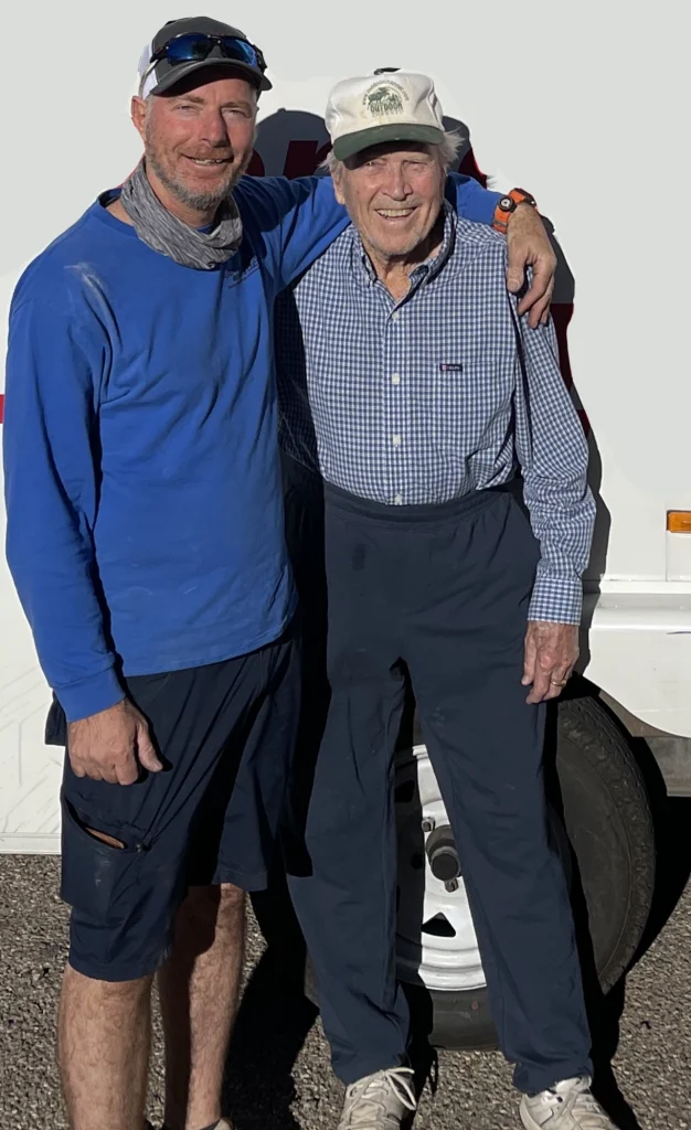 Owner of Abba and Sons Moving standing with a satisfied senior customer after a successful assisted living move, providing compassionate senior moving services.