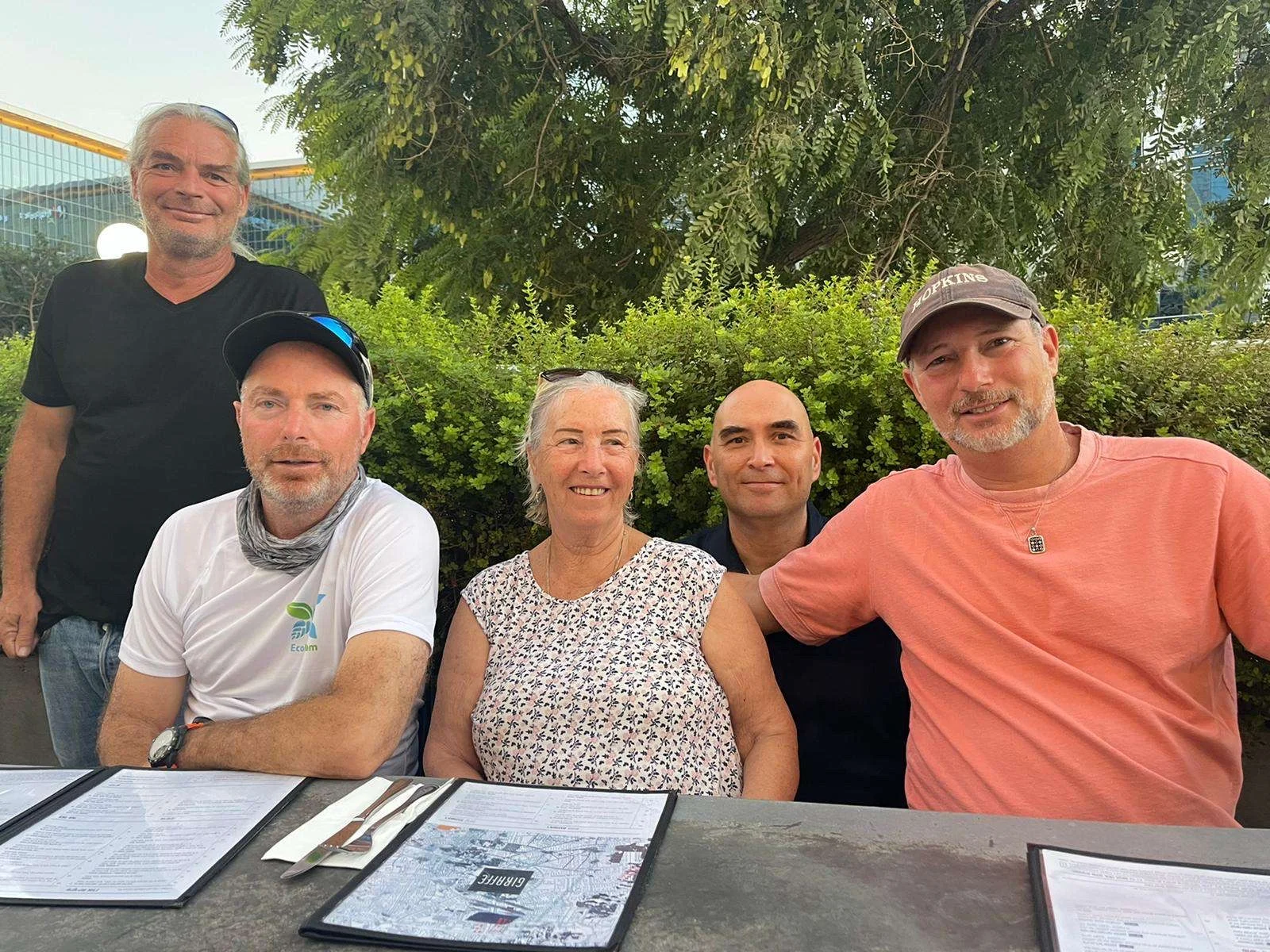 Abba and Sons Moving family members gathered together at an outdoor restaurant table